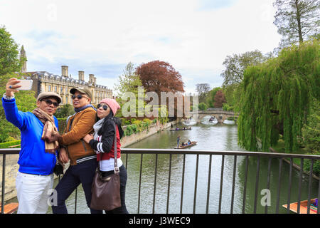 Tourist take selfies with punting on the River Cam in Cambridge, England, UK