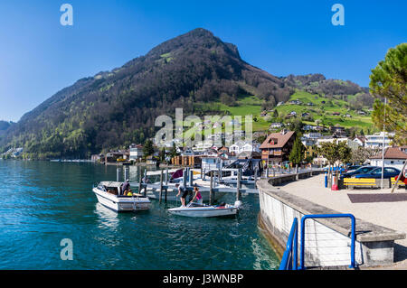 View of Rigi mountain from the village of Gersau, situated on the shore of Lake Lucerne (Vierwaldstättersee) in Switzerland. Leisure boats mooring. Stock Photo