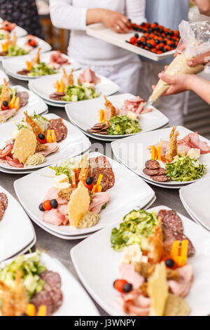 Chef is cooking set of appetizers. Catering table set service Stock Photo
