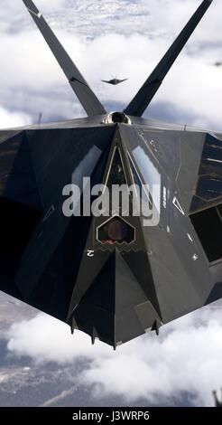 A USAF F-117A Nighthawk stealth attack aircraft flies over the Holloman Air Force Base March 4, 2005 near Alamogordo, New Mexico.    (photo by Lance Cheung /US Air Force  via Planetpix) Stock Photo