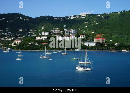 View of Long Bay, St. Thomas island, US Virgin Islands from water with multiple yachts and boats on the foreground Stock Photo