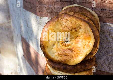 Closeup view of well cooked delicious Ramadan pita, Ramazan pidesi in Turkish, for is a traditional soft leavened Turkish bread. Stock Photo