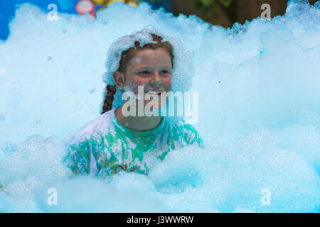 Weymouth, Dorset, UK. 7th May, 2017. Weldmar's Bubble Rush takes place at Weymouth to raise funds for the charity with about 2000 people expected to take part, running through bubbles of different colours. The bubbles were higher than many of the children who disappeared, then emerged looking like bubble monsters! Credit: Carolyn Jenkins/Alamy Live News Stock Photo