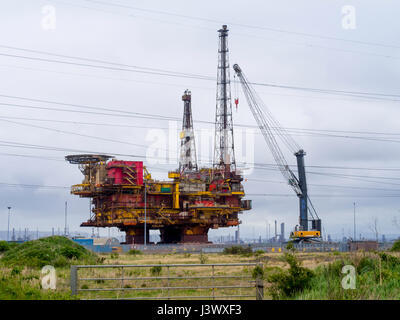 Seaton Carew Co. Durham England UK 7 May 2017. The topside deck of the Shell Brent Delta Oil and Gas Offshore Production platform has been removed after some 40 years service in the North Sea. It was transported as a record-breaking single 24,000 tons load to the Able UK facility at Seaton Carew for recycling.  The final phase of the sea transportation was on a barge, and preparations are in hand today to skid the platform off the Barge and on to a prepared concrete base where it will be safely demolished and recycled over the coming months Stock Photo