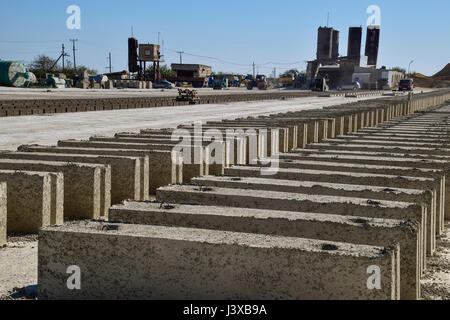 Cinder blocks lie on the ground and dried. on cinder block production plant Stock Photo