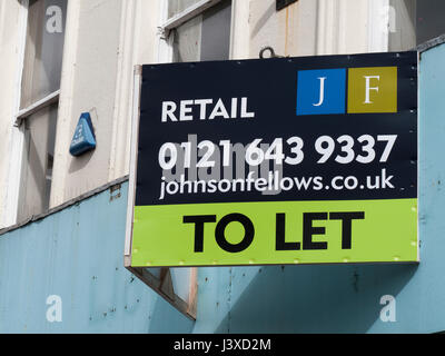 Tolet Shop Sign Shop to let sign over vacant retail premises Stock Photo - Alamy