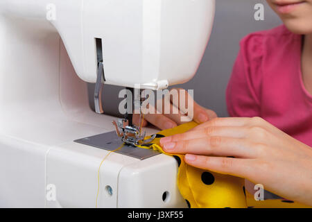 The sewing process on an electric sewing machine Stock Photo