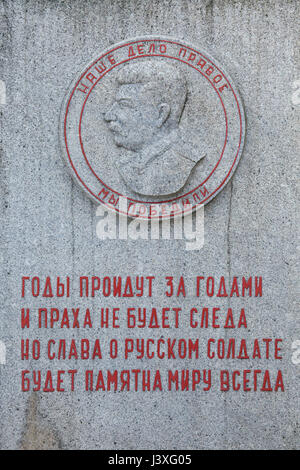 Soviet dictator Joseph Stalin depicted on the Soviet War Memorial at the Central Cemetery in Brno, Czech Republic. This is one of two places in the Czech Republic where Stalin is still depicted in public. The portrait is an enlarged copy of the Soviet medal 'For the Victory over Germany in the Great Patriotic War 1941-1945'. Inscriptions in Russian mean: Our cause is right. Victory is ours. Stock Photo