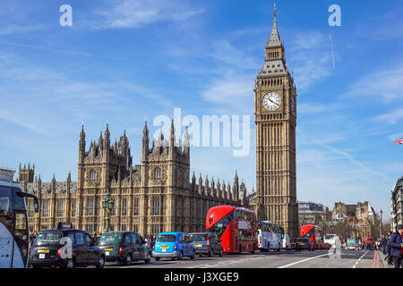 LONDON - 2017 APRIL 24 : There is tourism traffic everyday in London. Thousands cars, taxis, buses and pedestrians crossing River Thames on historic W Stock Photo