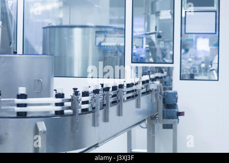 Bottles on production line in pharmaceutical plant Stock Photo