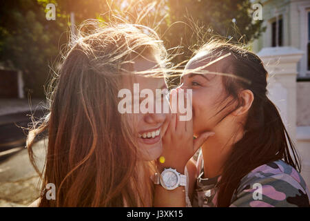 Teenage girls having fun in residential street, Cape Town, South Africa Stock Photo