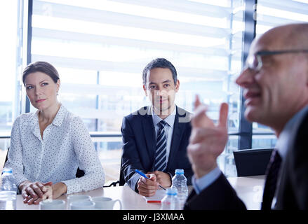 Businessman questioning during meeting Stock Photo