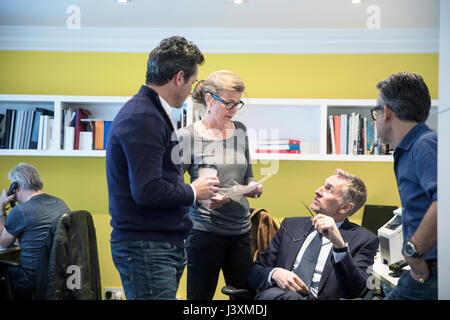 Colleagues in office having discussion Stock Photo