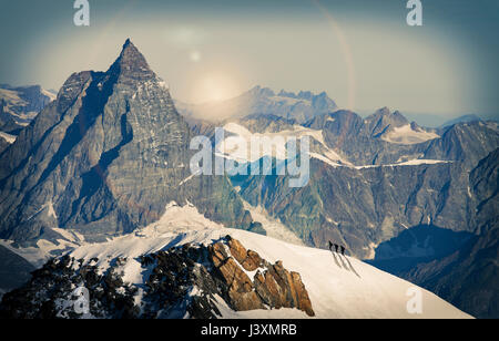 Climbers on snow covered mountain peak, Matterhorn, Zermatt, Switzerland Stock Photo