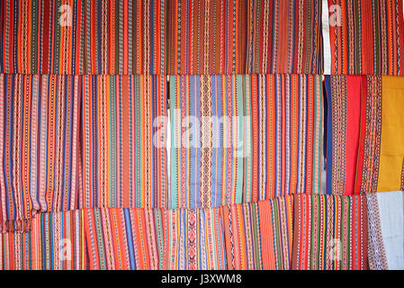 Peruvian colorful textile background. Traditional red peru fabric cloth Stock Photo
