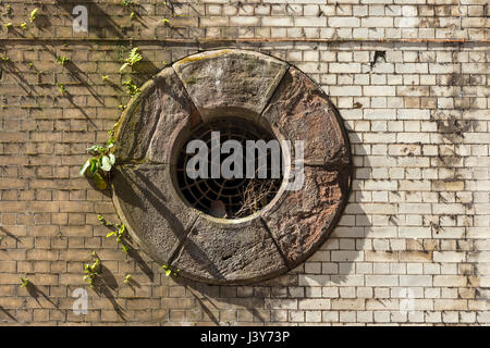 Circular ventilation hole on the undercroft of the former Exchange railway station, Manchester, England, UK Stock Photo