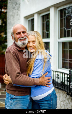 Portrait of senior couple, hugging, smiling Stock Photo