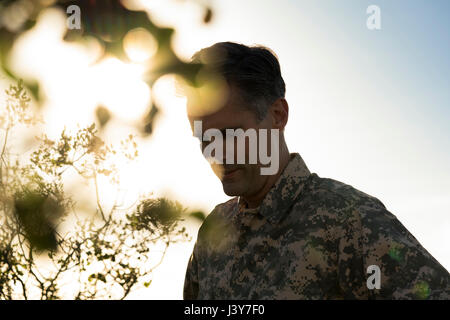 Portrait of soldier wearing combat clothing looking down, Runyon Canyon, Los Angeles, California, USA Stock Photo