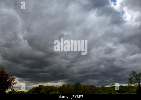 Sky with thunderclouds, rain clouds Thundercloud with possible formation of a tornado with a slight HDR effect. Stock Photo