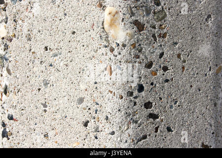 Concrete wall in small colored stone. Background texture. Photo for your design. Stock Photo