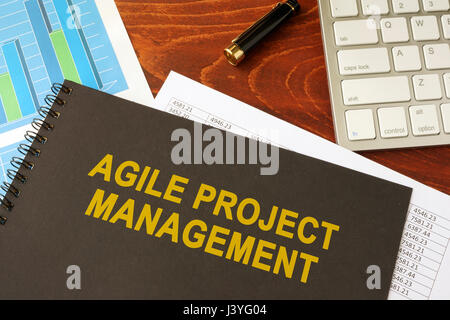 Book with title agile project management in an office. Stock Photo