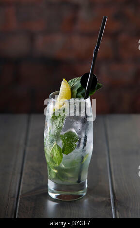 A mojito alcoholic cocktail seen on a table in a bar. Stock Photo