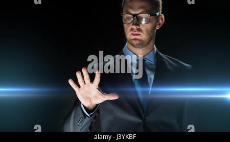businessman touching something imaginary Stock Photo