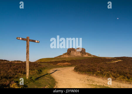 The Jubilee Tower at the summit of Moel Famau, Clwyd in North wales at sunset with the moon in the sky above the tower Stock Photo