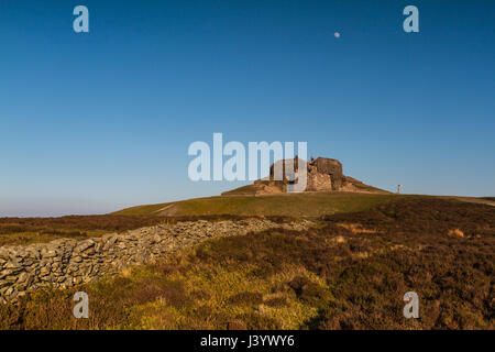 The Jubilee Tower at the summit of Moel Famau, Clwyd in North wales at sunset with the moon in the sky above the tower Stock Photo