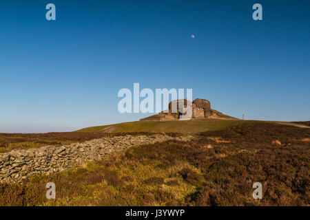The Jubilee Tower at the summit of Moel Famau, Clwyd in North wales at sunset with the moon in the sky above the tower Stock Photo