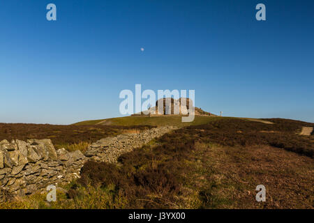 The Jubilee Tower at the summit of Moel Famau, Clwyd in North wales at sunset with the moon in the sky above the tower Stock Photo