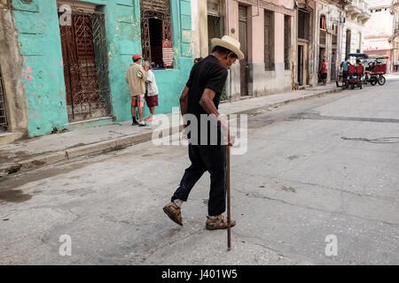 Old cuban man  with a walking stick and a straw hat on the streets of Havana, Cuba Stock Photo