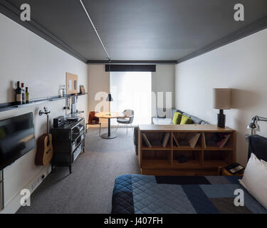 Bedroom. Ace Hotel Shoreditch, London, United Kingdom. Architect: EPR Architects Limited, 2016. Stock Photo