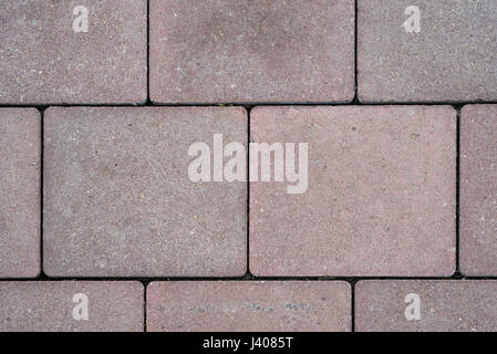 Concrete paving texture, top view of tiled gray square shaped slabs Stock Photo