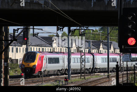 Super Voyager diesel multiple unit train in Virgin West Coast livery departing from platform 4 at Lancaster railway station on West Coast Main Line. Stock Photo