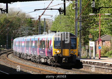 Class 350 electric multiple unit train, First Transpennine Express livery, arriving at platform 4 at Lancaster railway station on West Coast Main Line Stock Photo