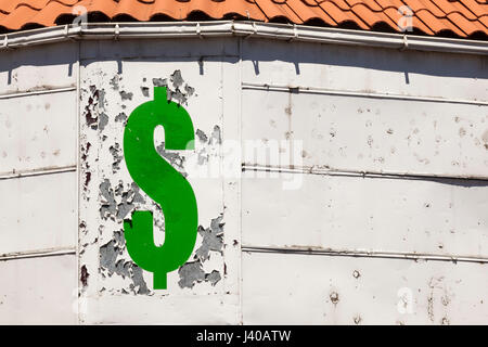 Detroit, Michigan - Peeling paint and a dollar sign on a closed store. Stock Photo