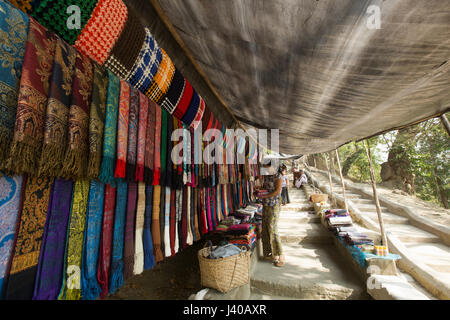 Ethnic girls selling traditional fabrics at Moheskhali Island. Cox’s Bazar, Bangladesh. Stock Photo