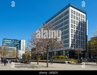 The 'Two St. Peter's Square' building (SimpsonHaugh and Partners 2017), and the Metrolink tram stop, St. Peter's Square, Manchester, England, UK Stock Photo