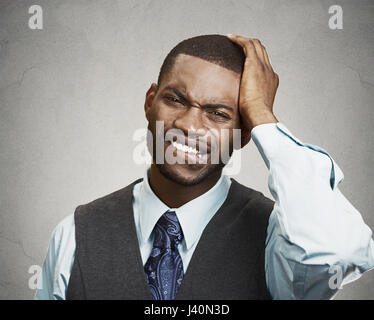 portrait of desperate man, isolated on grey wall background. Negative human facial expressions, emotions, feelings, body language, life perception Stock Photo