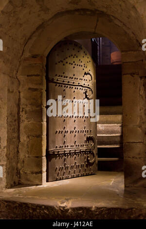 A doorway from an underground room opening out onto a staircase Stock Photo