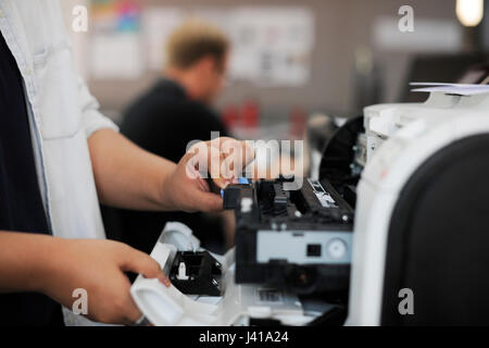 People Hands Opening Checking Printer in Office Stock Photo