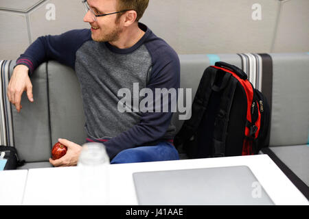 People Talking Together During Office Break Time Stock Photo