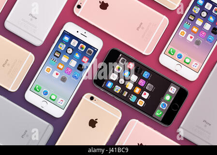 Set of multicolored Apple iPhones 6s flat lay top view with iOS 10 on the screen Stock Photo