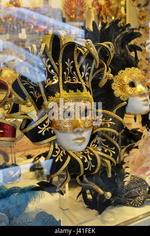 Venetian masks in store display in Venice. Annual carnival in Venice is among the most famous in Europe. Its symbol is the Venetian mask Stock Photo