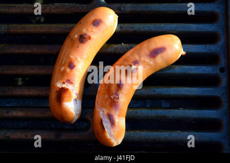 High angle view of two sausages on barbeque grill Stock Photo