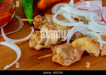 Chicken tikka kebabs with red onion and peppers. Chicken skewers onion pepper adjika Stock Photo