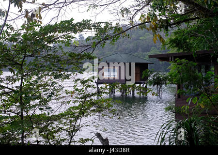 Cabins of Las Lagunas Boutique Hotel located on the bank of the Exequil Lagoon near the city of Flores in Peten department northern Guatemala Stock Photo