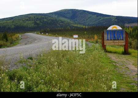 Canada-Alaska highway with road sign welcoming travelers from Alaska to Yukon Territory, Canmada Stock Photo