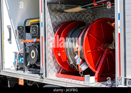 fire hoses and other fire fighting equipment on board a fire truck Stock Photo